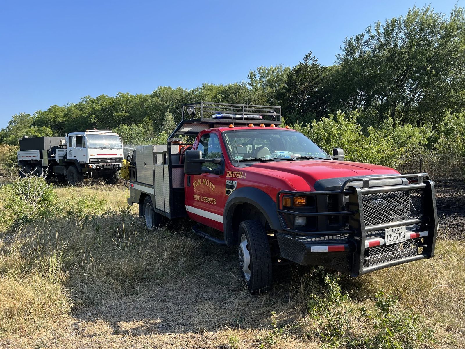 Elm Mott brush trucks working a grass fire