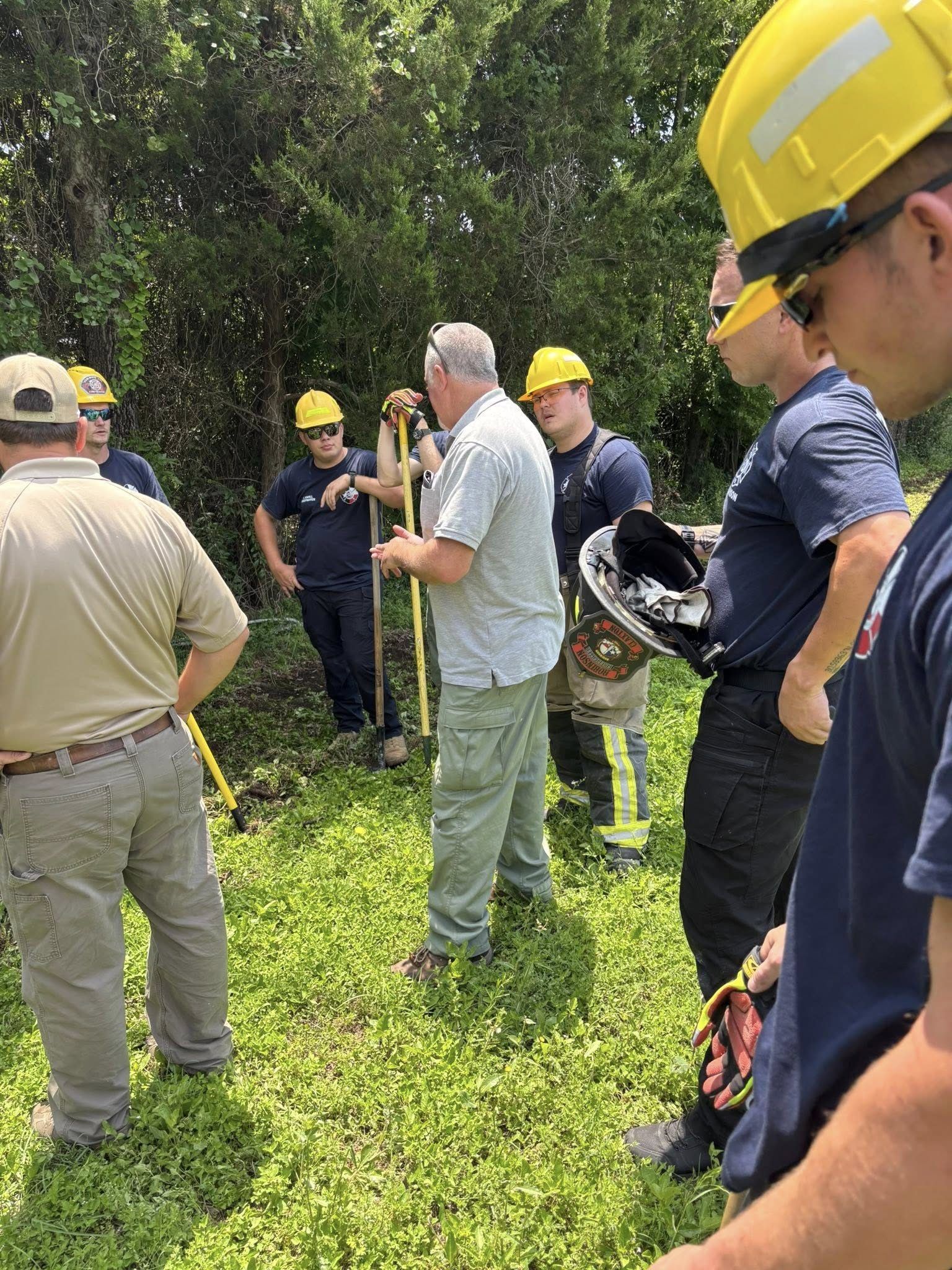 Members train on rural water supply in the woods
