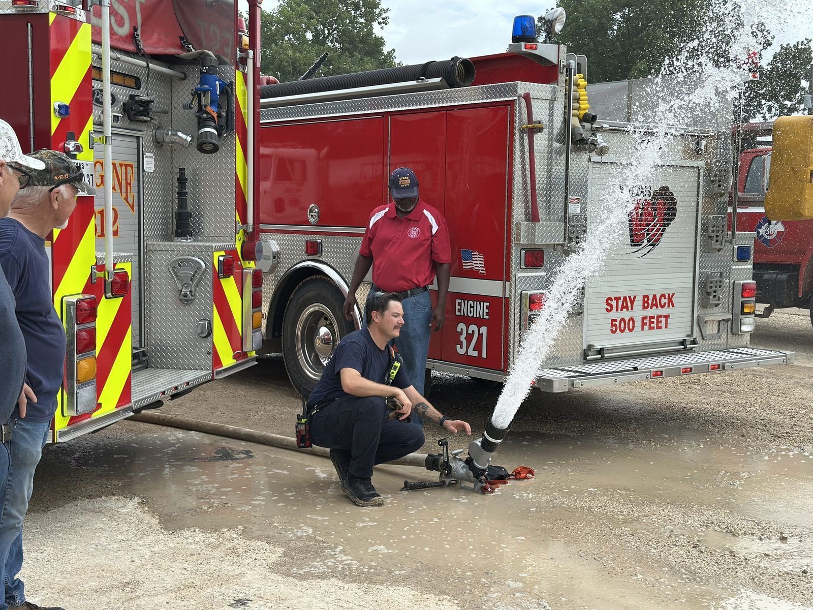 Members demonstrate apparatus for the crowd