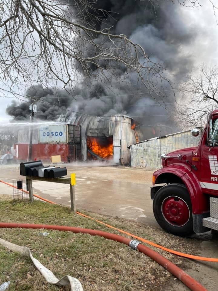 Crews work a heavy daytime structure fire
