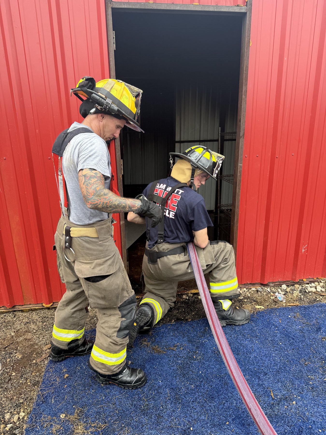 Advancing a hose line into the burn building