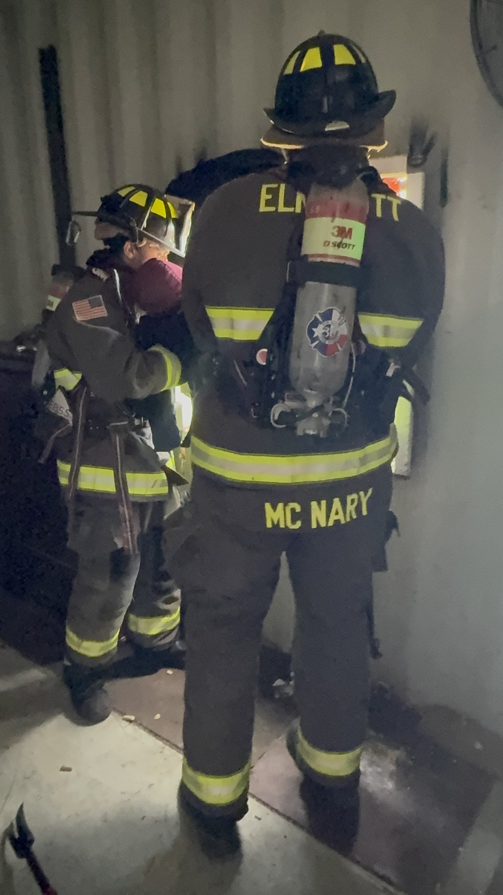 An Elm Mott firefighter in full SCBA during an interior search drill